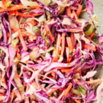 Close up of cilantro lime slaw for shrimp tacos includes colorful ingredients that are fresh, crisp and creamy -- perfect for fish tacos