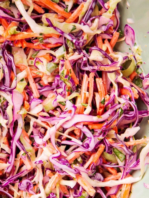 Close up of cilantro lime slaw for shrimp tacos includes colorful ingredients that are fresh, crisp and creamy -- perfect for fish tacos