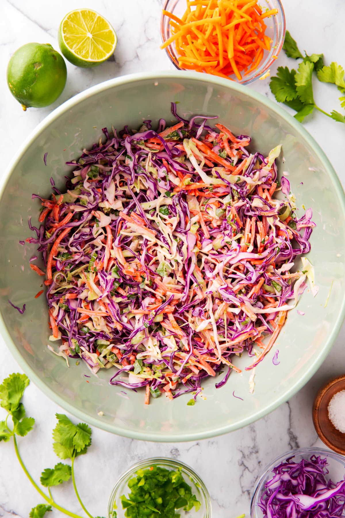 Creamy cilantro lime slaw is coated in a mayonnaise and lime juice based dressing with lots of cilantro, cabbage, and veggies