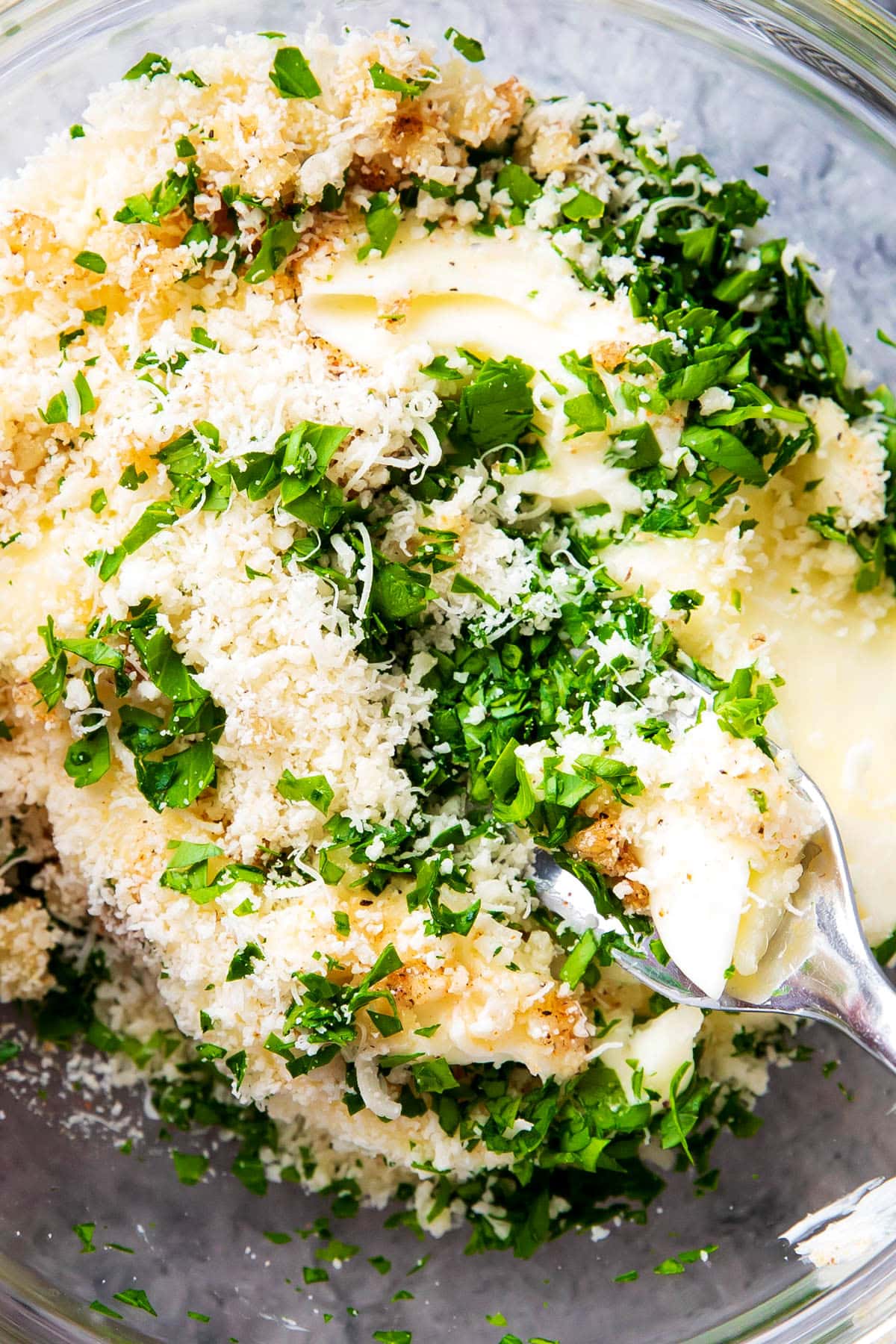 Close up of Garlic Butter ingredients to show them being mixed together to make this homemade spread.