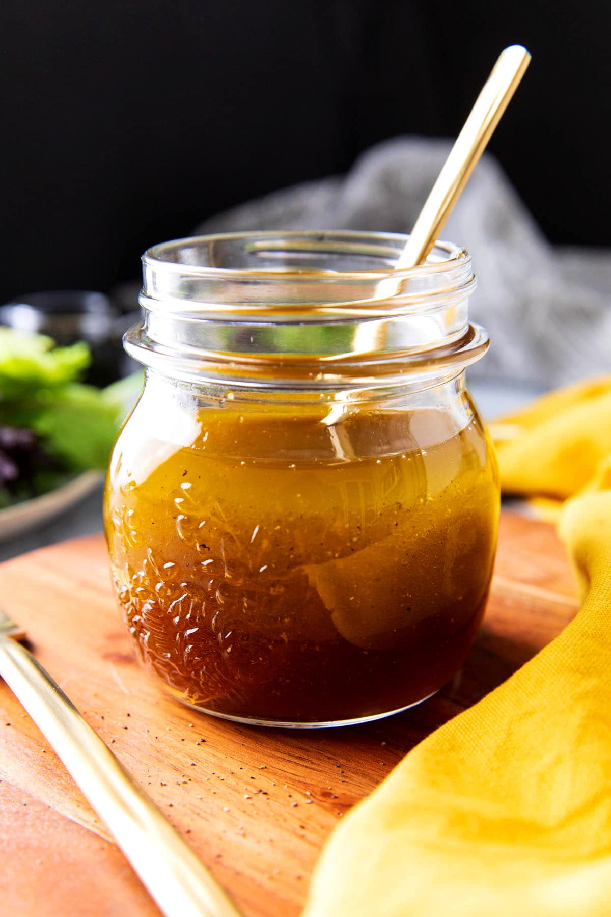 This dijon salad dressing recipe is served with fresh salad greens and shaken until emulsified before serving.