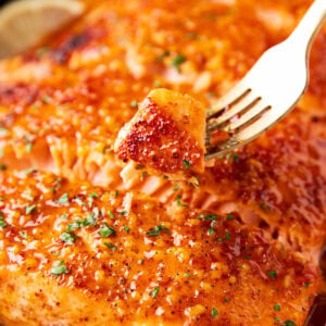 Close up of Honey Mustard Salmon is baked until tender and flaky with a delicious marinade sauce.