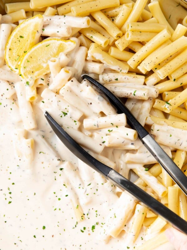 Creamy Parmesan Pasta in a pan with cooked pasta
