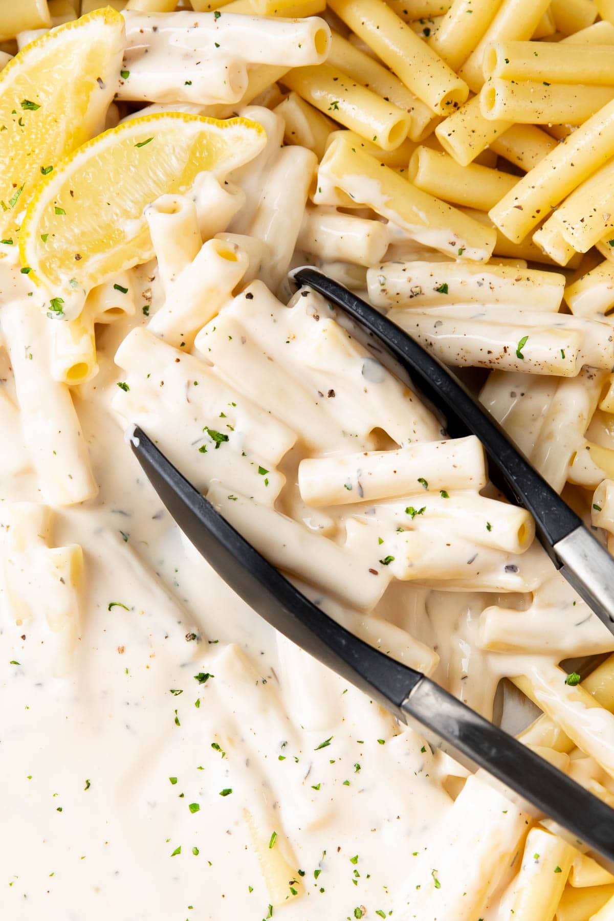 Close up of this creamy parmesan pasta recipe to show rich Parmesan cream sauce coating perfectly cooked pasta.