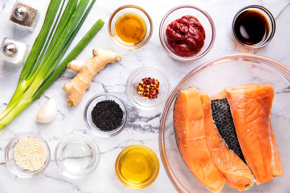 Gochujang Salmon ingredients include gochujang pasta, salmon, honey, garlic, soy sauce, mirin, toasted sesame oil, and ginger.