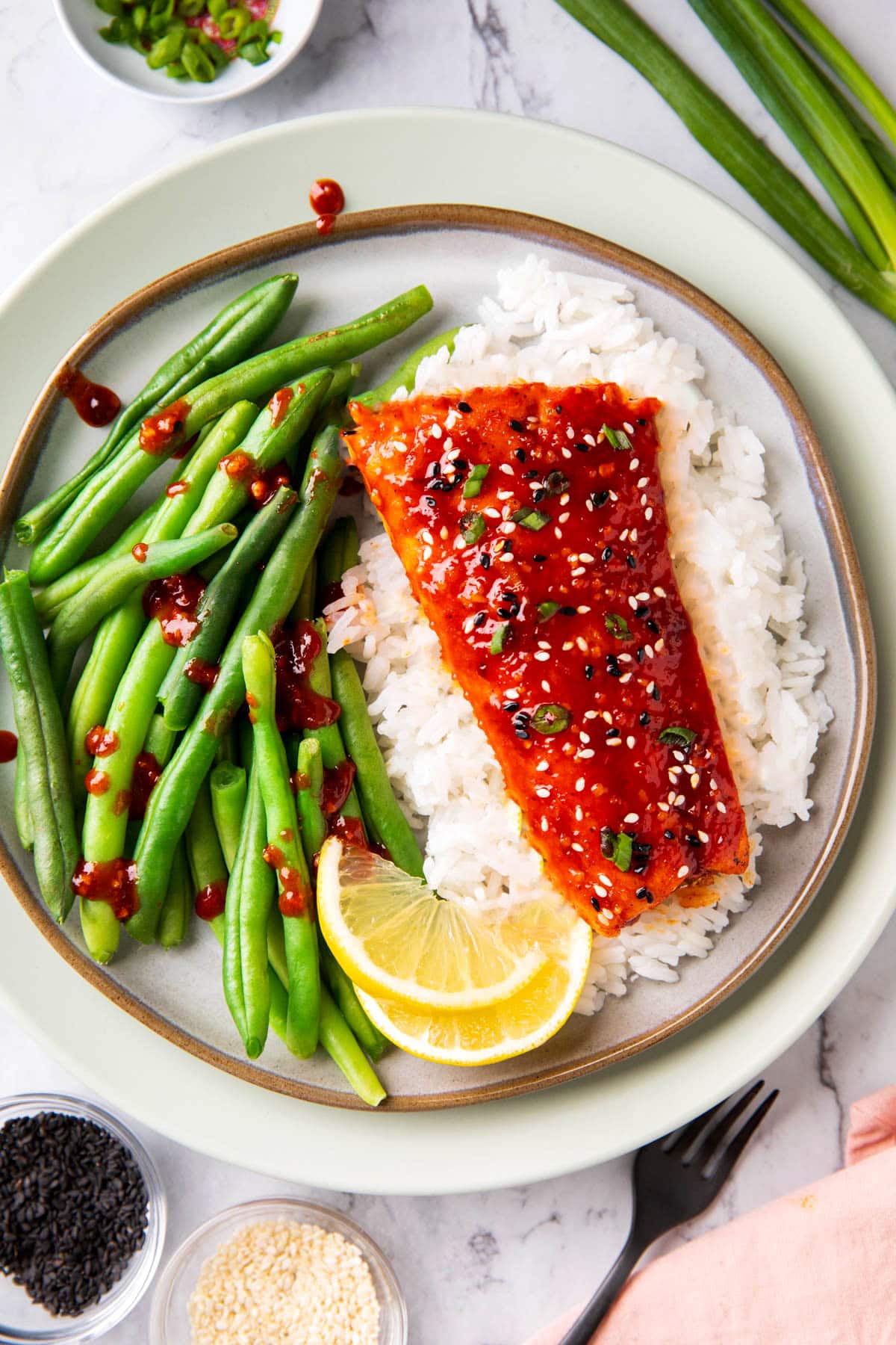 This Korean fish recipe is served with rice, extra sweet and spicy sauce, and green beans.